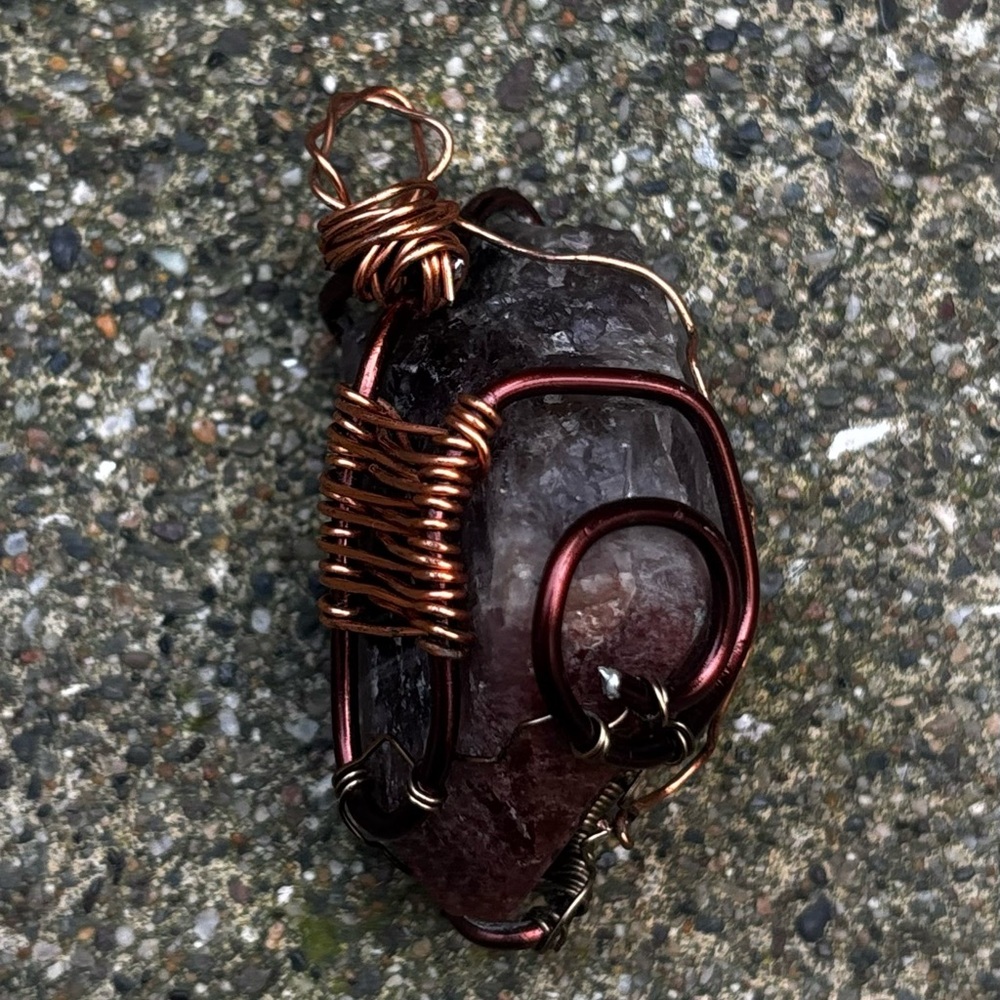 Handcrafted copper wire-wrapped raw gemstone pendant